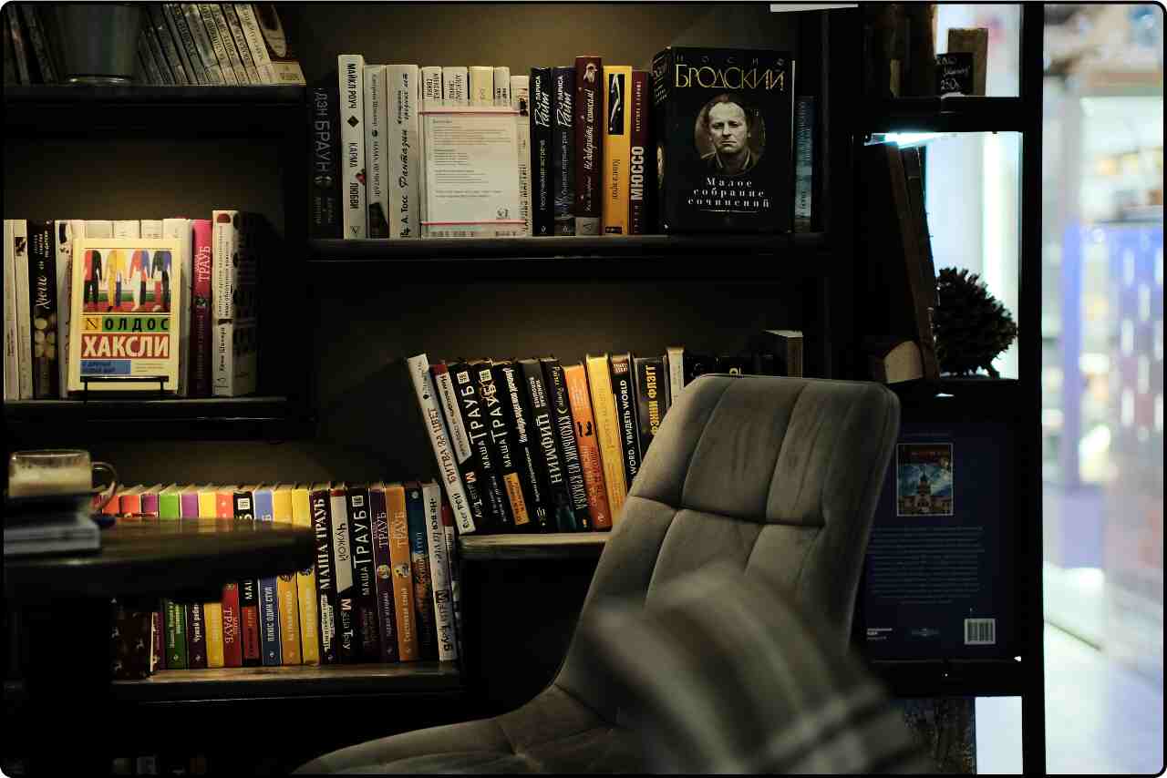 Modern office space with bookshelves along the wall.